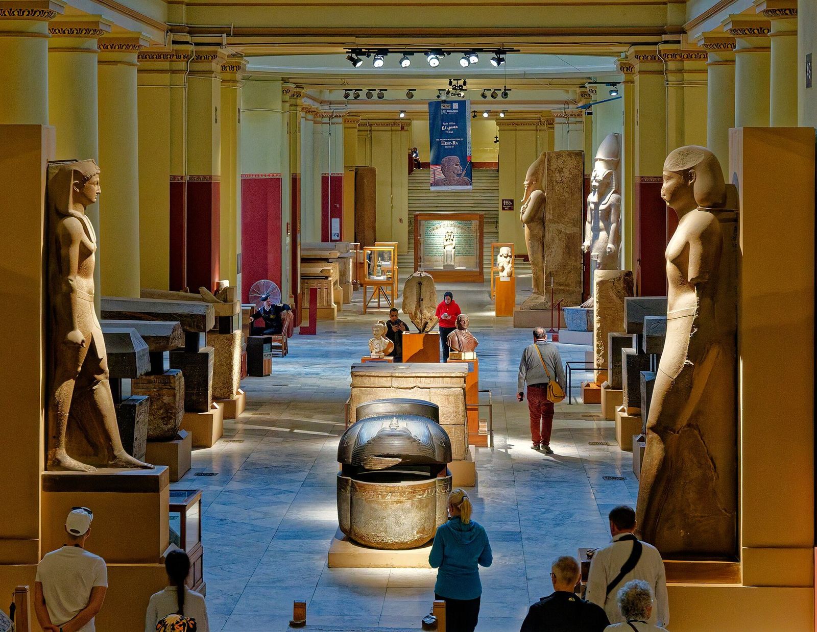 Statues and sarcophagi in a gallery of the Egyptian Museum, Cairo