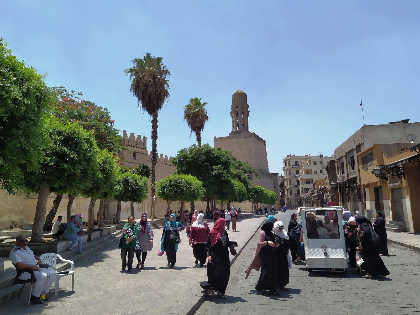 Al-Muizz Street by the walls of Fatimid Cairo, with the minaret of the Mosque of al-Hakim